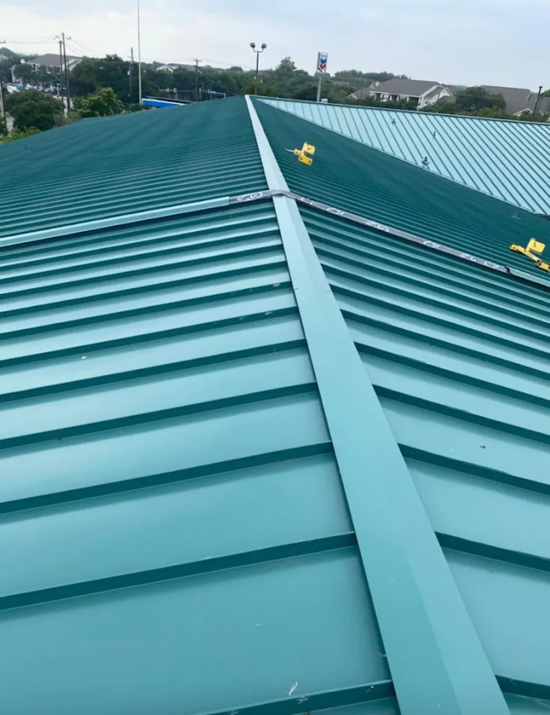 Green commercial metal roof ridge and valley for Metal Roof Repair in Mango